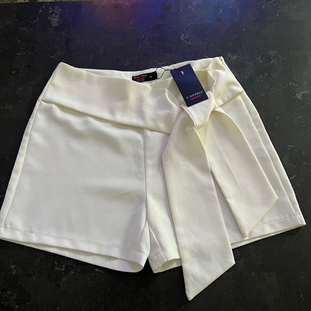 White shorts, fits like a medium size.